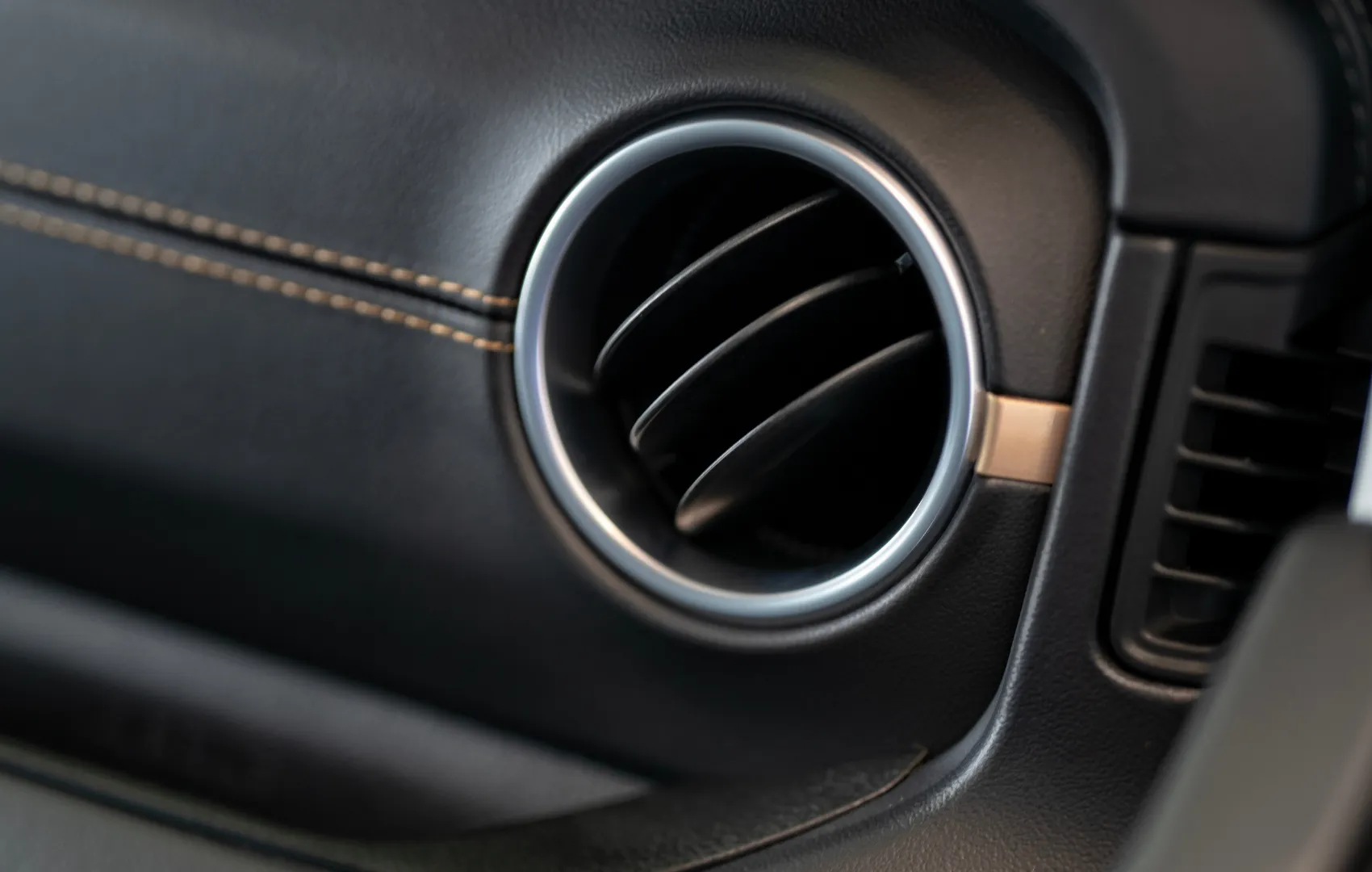 Close up of a Jeep air vent in passenger seat